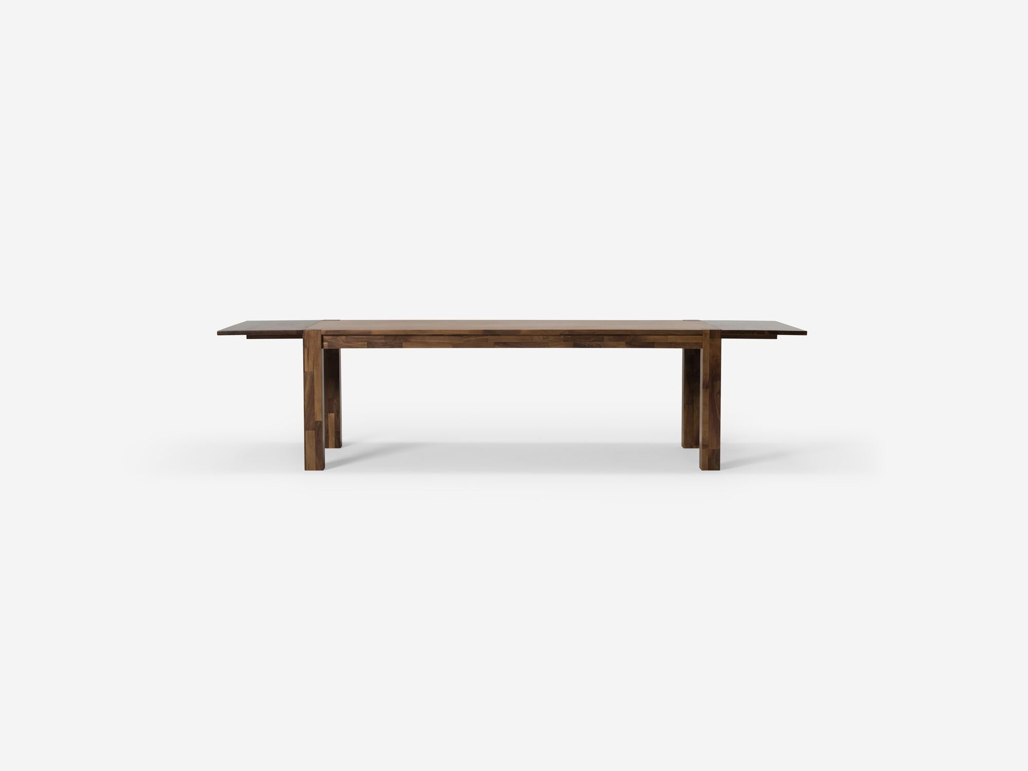 Front view of large walnut rustic dining table with two leaves